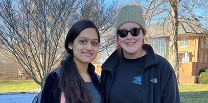 Student smiling with Garland Library in background